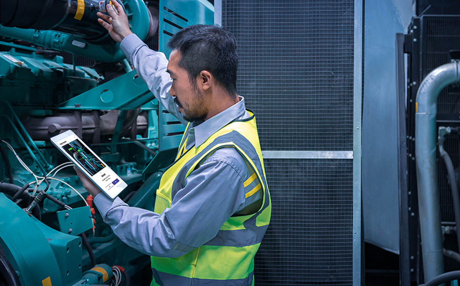 engineer inspecting ship engine with digital instructions and ai state detection