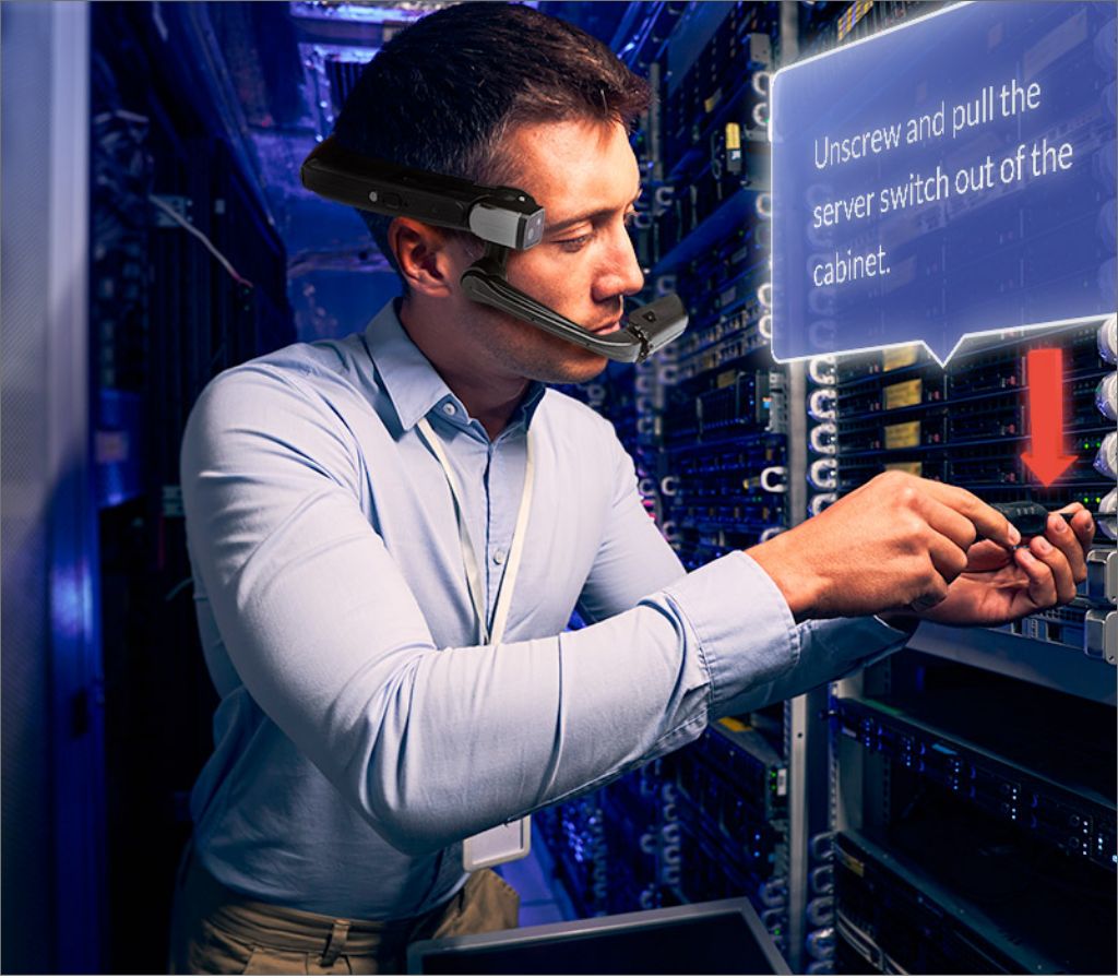 junior technician using smart glasses and AR remote assistance to repair data rack 